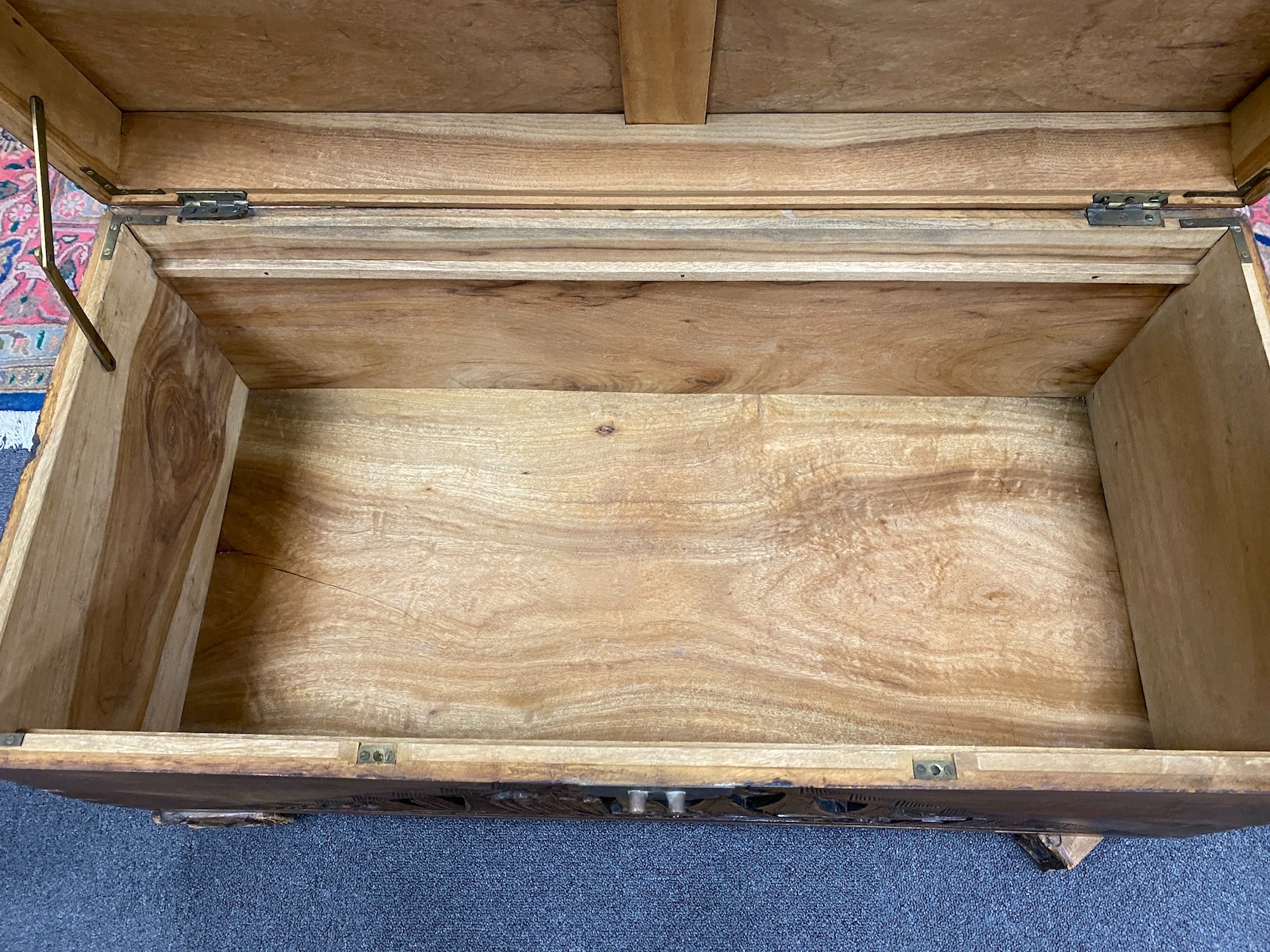 A Chinese carved camphorwood coffer and similar smaller box, larger length 93cm, depth 44cm, height 49cm